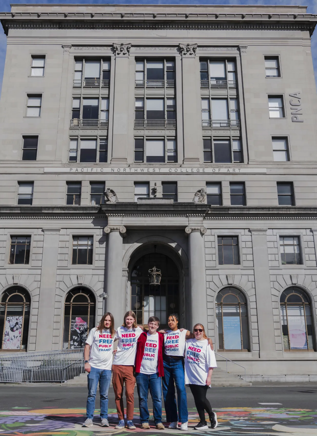 Students wering matching t-shirts stand in front of PNCA